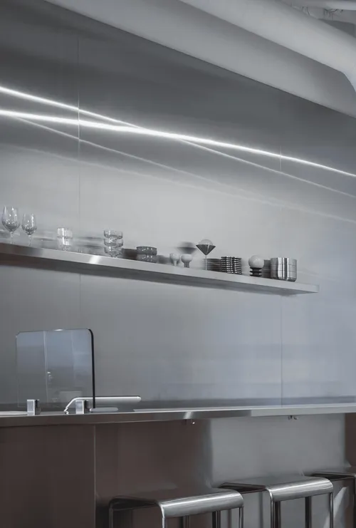 Stainless steel shelves in the Nui kitchen