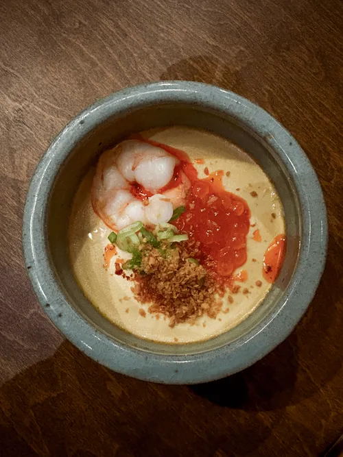 Tofu egg jjim with prawn, ikura and crispy garlic